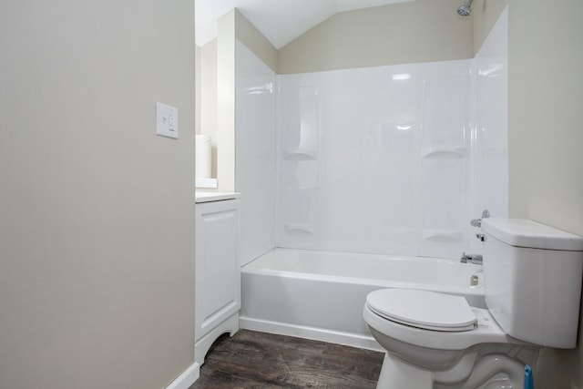 full bathroom with hardwood / wood-style floors, vanity,  shower combination, lofted ceiling, and toilet