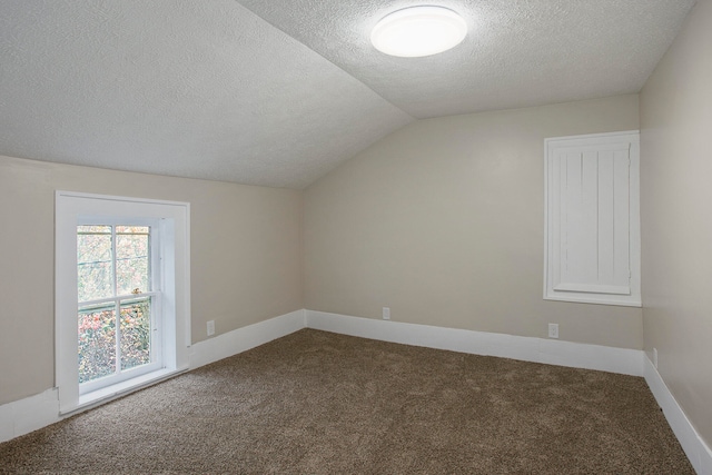 bonus room with carpet flooring, a textured ceiling, and vaulted ceiling