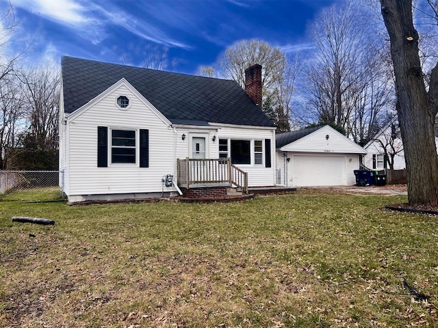 1060 Cross St, Saginaw, MI 48602 - view of front of home with a garage, a chimney, an outbuilding, and a shingled roof
