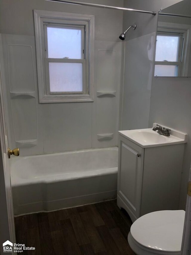 1404 E Kurtz Ave, Flint, MI 48505 - bathroom featuring vanity, wood finished floors, plenty of natural light, and toilet