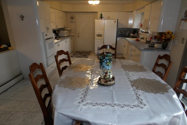 dining space featuring baseboard heating