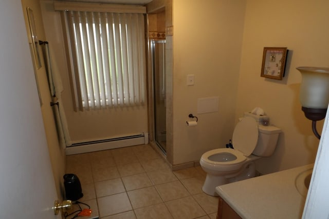 bathroom with vanity, a baseboard heating unit, tile patterned flooring, toilet, and a shower with shower door