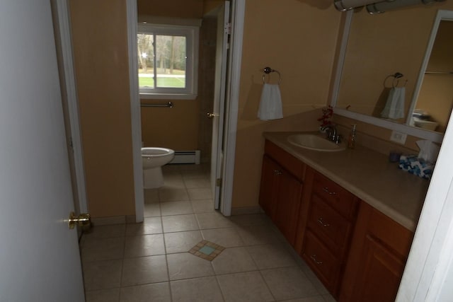 bathroom featuring tile patterned flooring, vanity, toilet, and baseboard heating