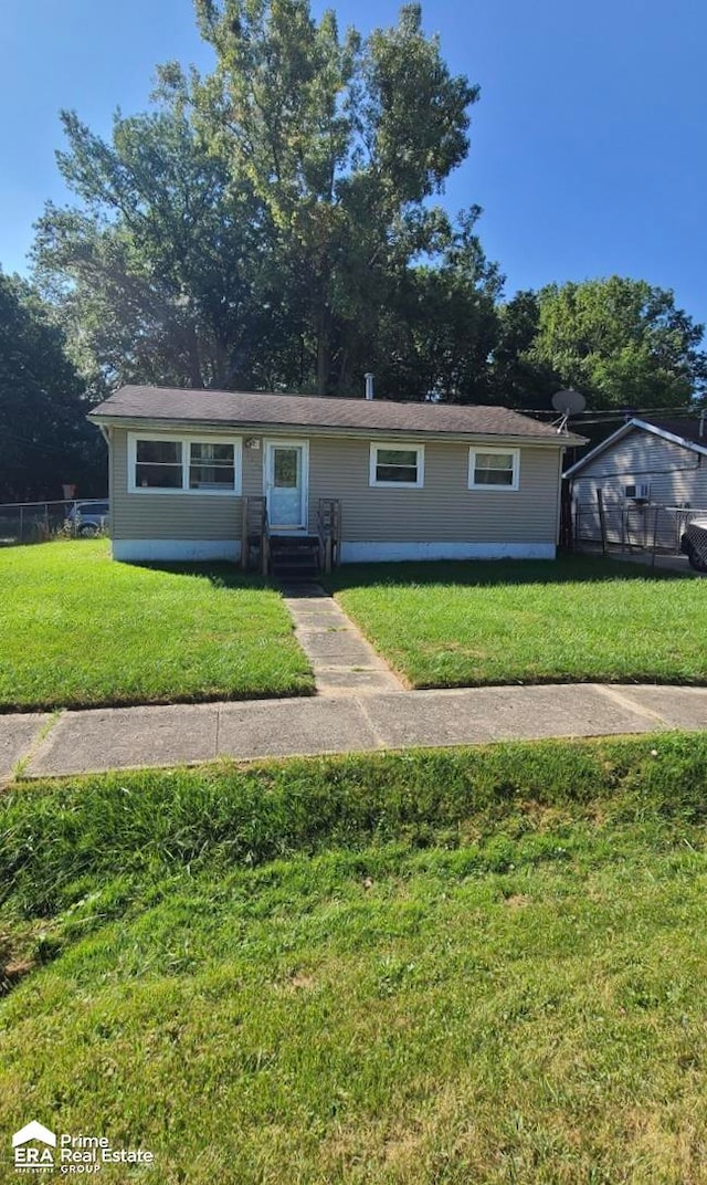 view of front of property with a front lawn