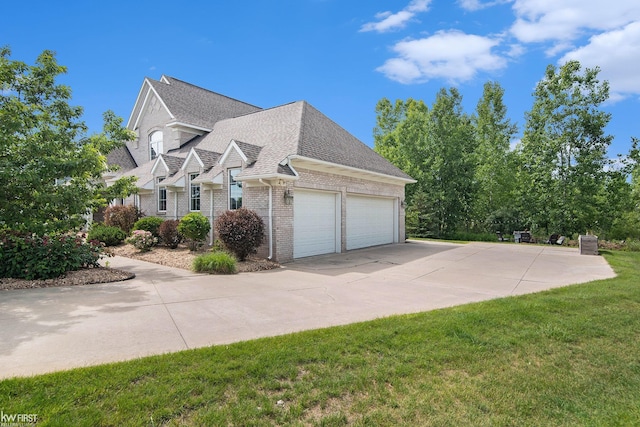 view of side of home featuring a lawn and a garage