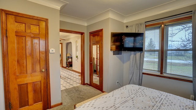 bedroom featuring crown molding