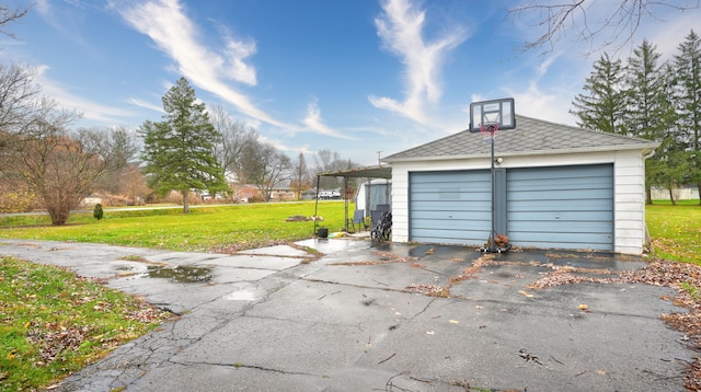 garage featuring a lawn