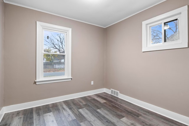 unfurnished room with crown molding and dark hardwood / wood-style floors