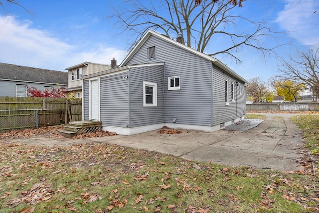 rear view of property featuring a patio area