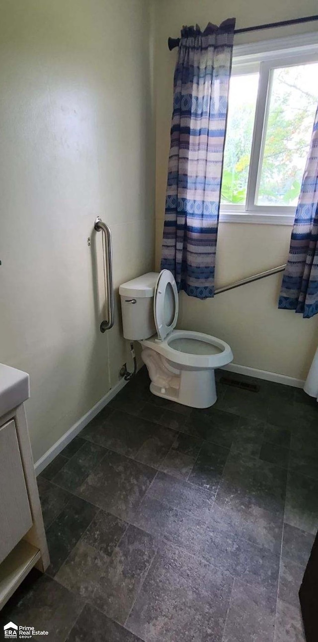 bathroom with vanity and toilet