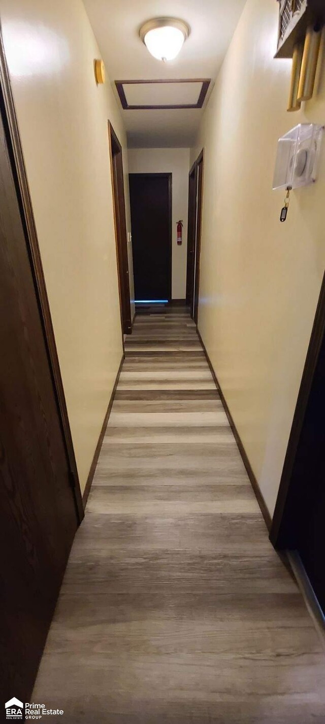 1587 Mcalpine Dr, Mount Morris, MI 48458 - hallway featuring wood finished floors and baseboards