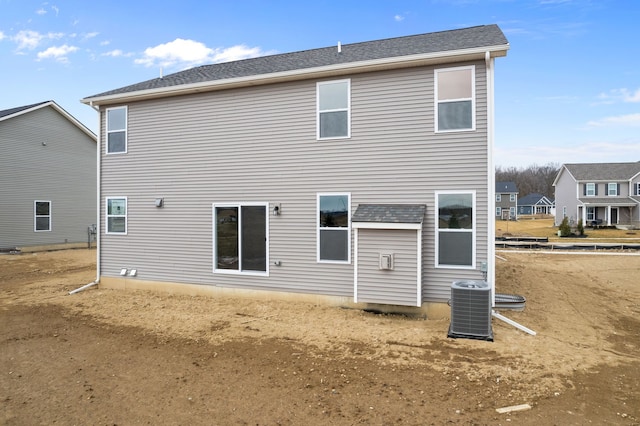 rear view of property with central air condition unit