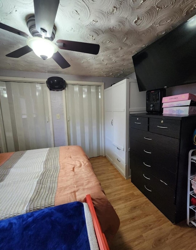 bedroom featuring ceiling fan and light wood-type flooring