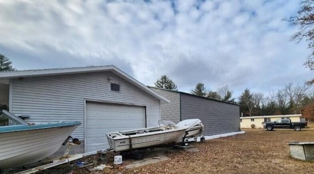 view of side of property featuring a garage