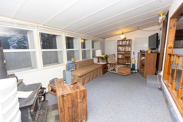 living area featuring vaulted ceiling and carpet floors