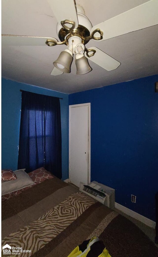 3412 Comstock Ave, Flint, MI 48504 - unfurnished bedroom with a ceiling fan and carpet floors