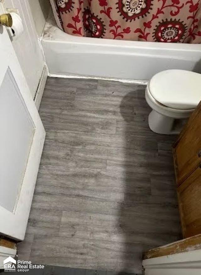 3412 Comstock Ave, Flint, MI 48504 - full bathroom featuring wood finished floors and toilet
