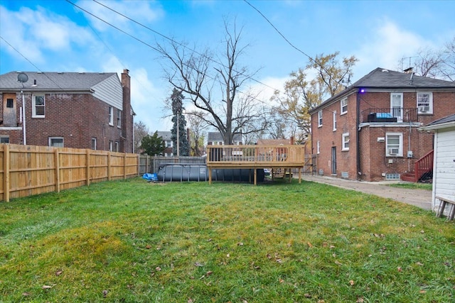 view of yard featuring a swimming pool side deck