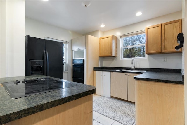 kitchen with sink, light tile patterned floors, and black appliances