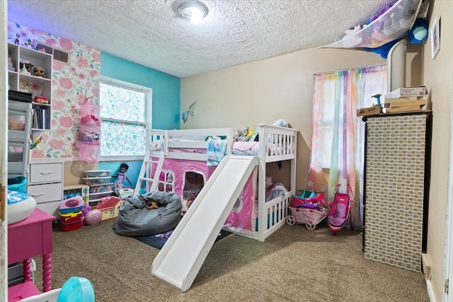 bedroom with carpet flooring and a textured ceiling