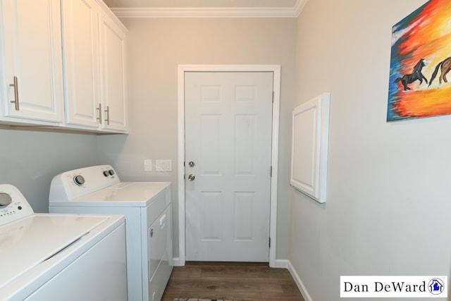 laundry room featuring cabinets, dark hardwood / wood-style floors, ornamental molding, and independent washer and dryer