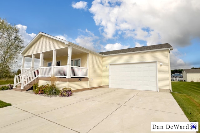 view of front of property with a garage and a porch