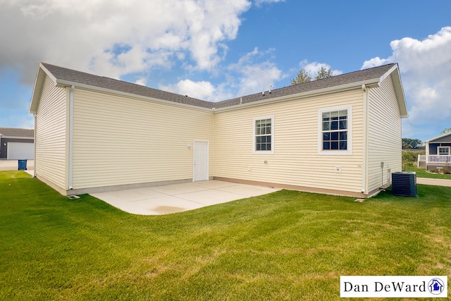 back of property featuring central AC unit, a yard, and a patio