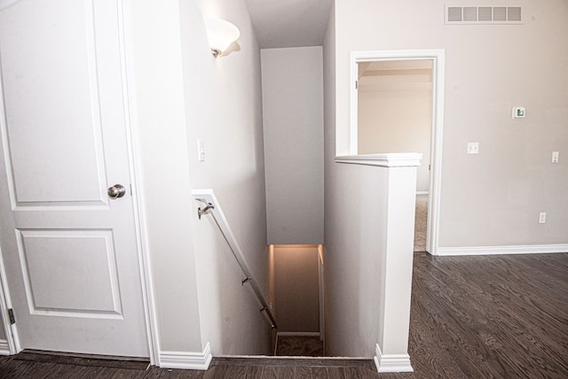 stairway featuring hardwood / wood-style flooring