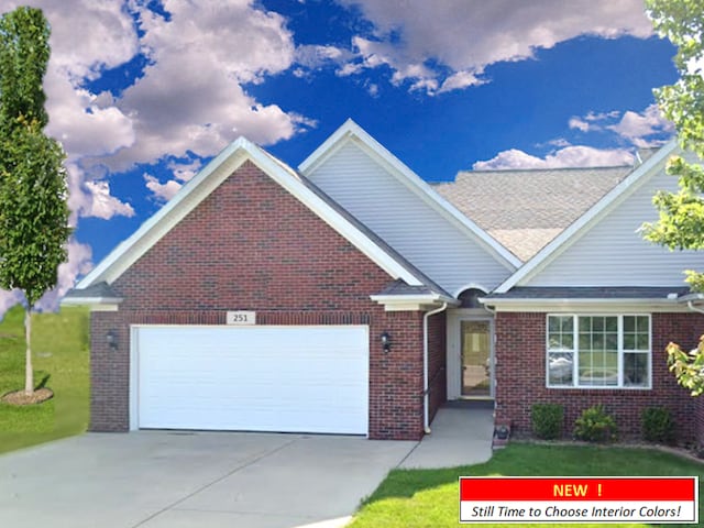 view of front of home featuring a garage and a front yard