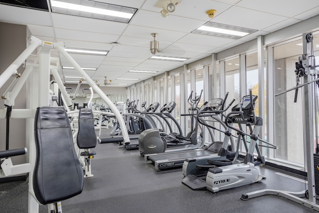 exercise room featuring a drop ceiling