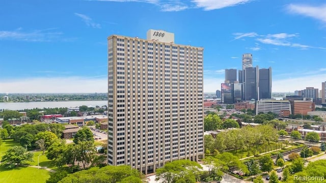 view of building exterior with a view of city and a water view