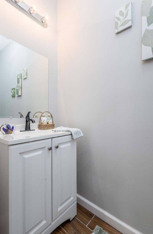 bathroom with wood-type flooring and vanity