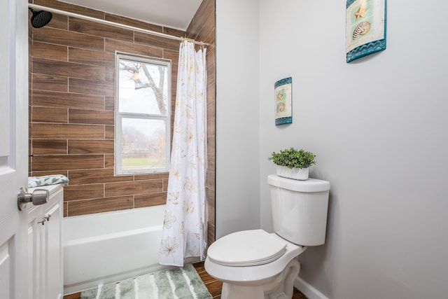 full bathroom with hardwood / wood-style floors, toilet, plenty of natural light, and shower / bath combo with shower curtain