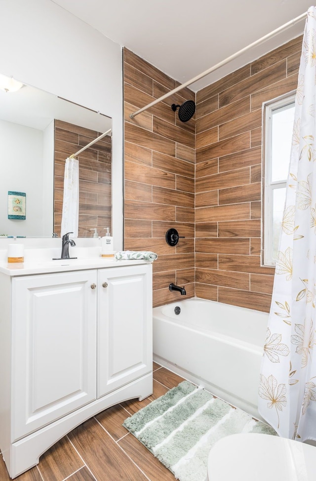 bathroom with vanity, hardwood / wood-style flooring, and shower / tub combo with curtain