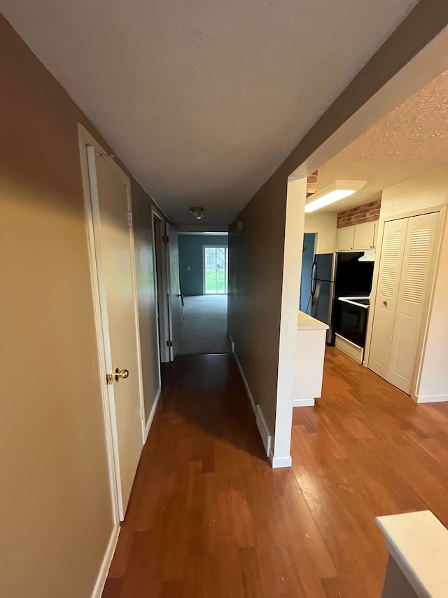 hall featuring wood-type flooring