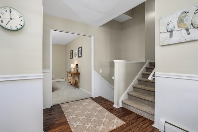 entryway with baseboard heating and dark wood-type flooring