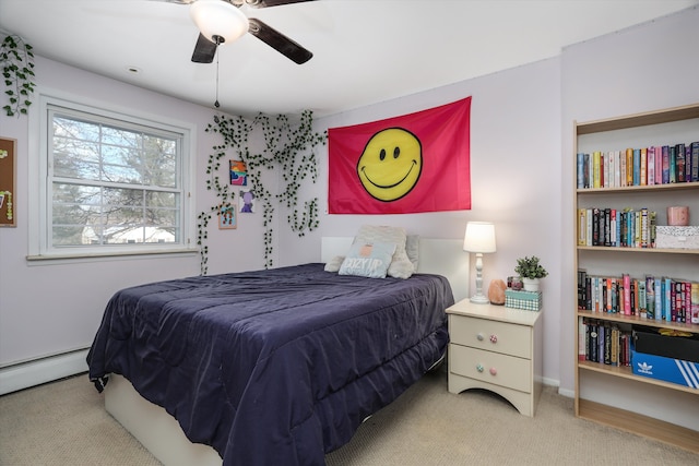 bedroom featuring ceiling fan, light colored carpet, and a baseboard heating unit