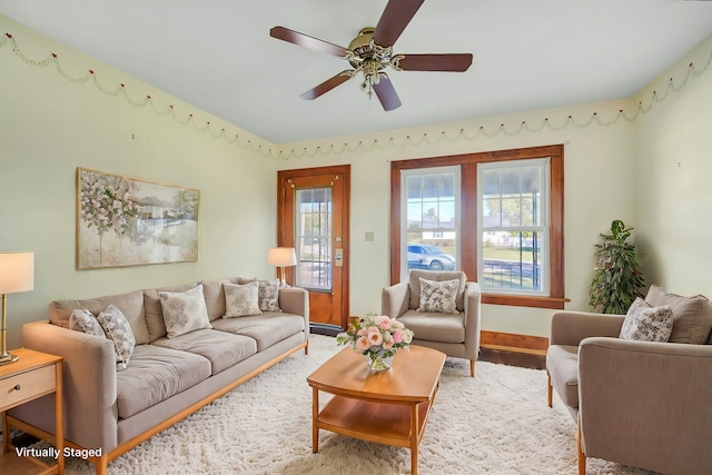 living room with hardwood / wood-style floors and ceiling fan