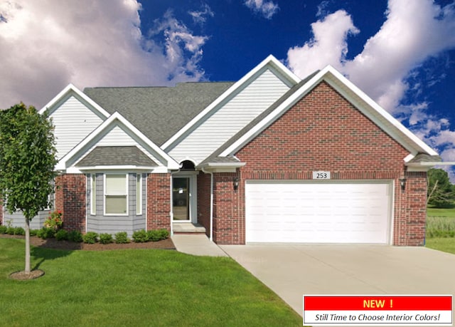 view of front of house with a garage and a front lawn