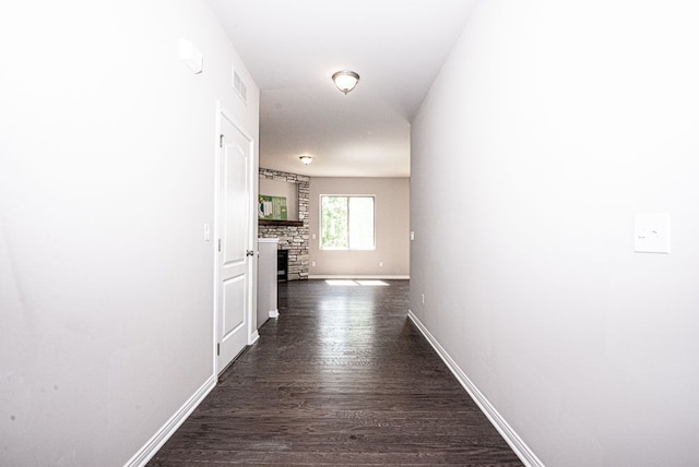 hall featuring dark wood-type flooring