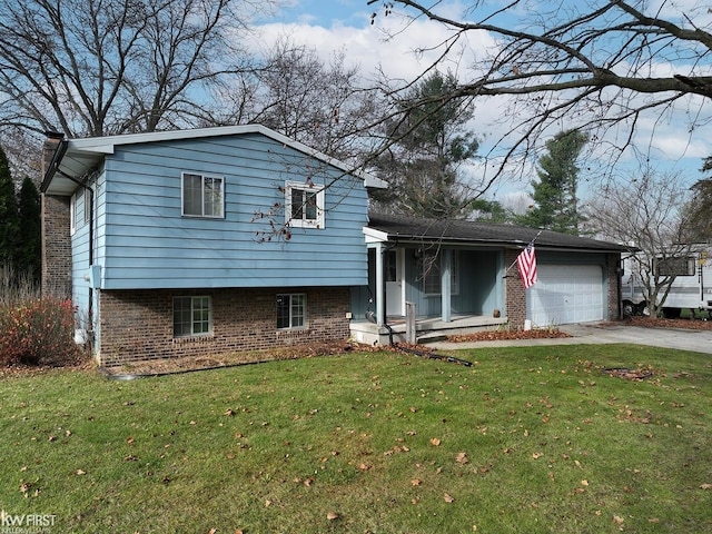 tri-level home featuring a garage and a front lawn