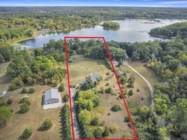 birds eye view of property featuring a water view