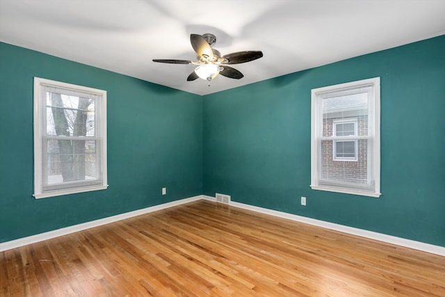 spare room featuring ceiling fan and light wood-type flooring