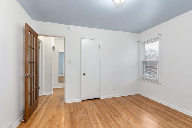 unfurnished bedroom with light hardwood / wood-style flooring