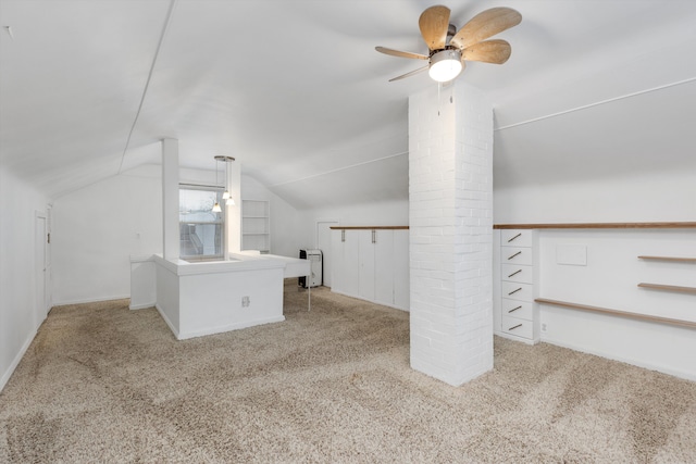 bonus room with decorative columns, vaulted ceiling, light colored carpet, and ceiling fan