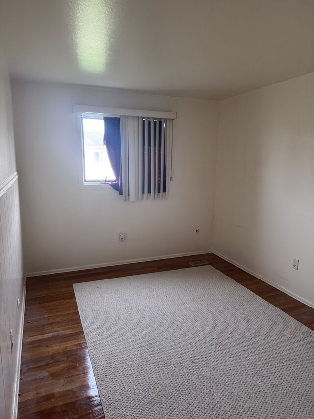19975 S Great Oaks Cir, Clinton Township, MI 48036 - spare room featuring dark wood-style floors and baseboards