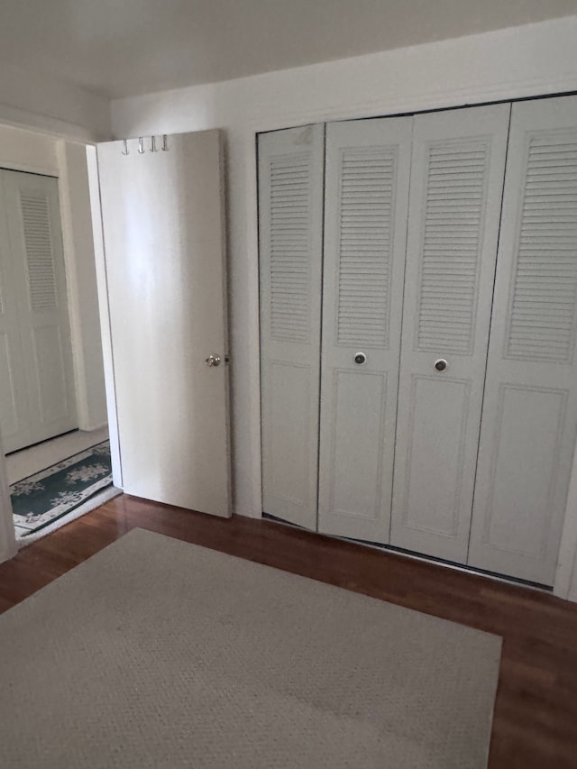 19975 S Great Oaks Cir, Clinton Township, MI 48036 - unfurnished bedroom featuring wood finished floors and a closet