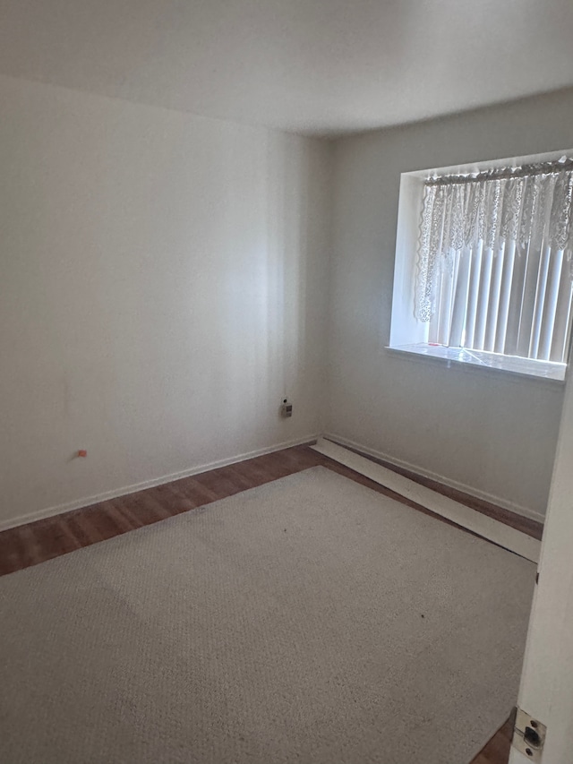 19975 S Great Oaks Cir, Clinton Township, MI 48036 - spare room featuring wood finished floors, baseboards, and baseboard heating