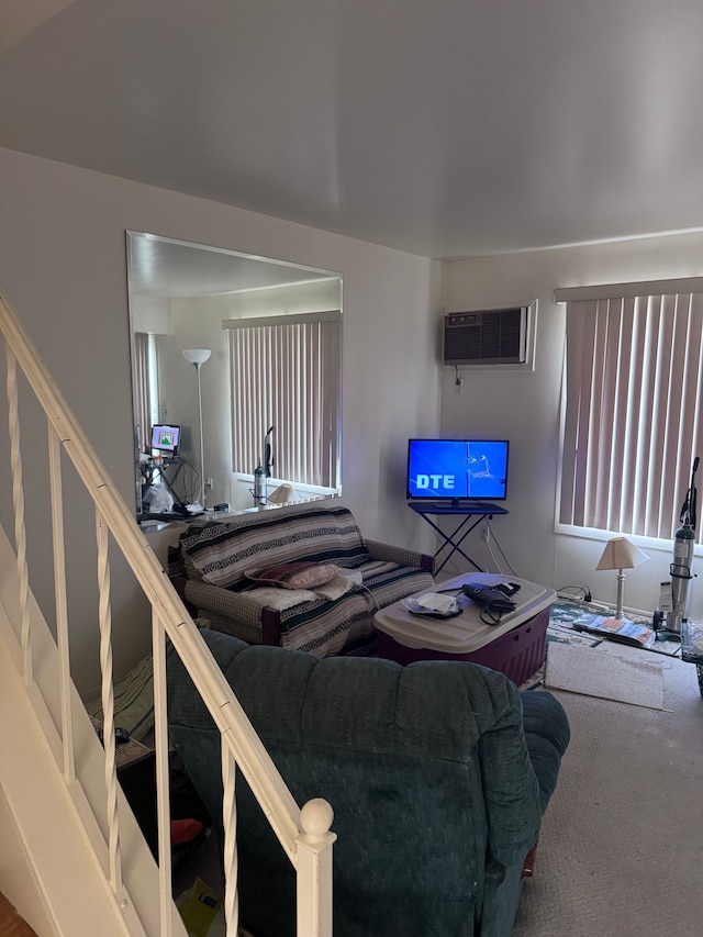 19975 S Great Oaks Cir, Clinton Township, MI 48036 - living area featuring an AC wall unit, carpet flooring, and stairway