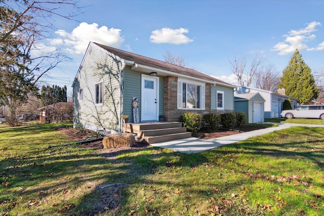 view of front of home featuring a garage and a front lawn